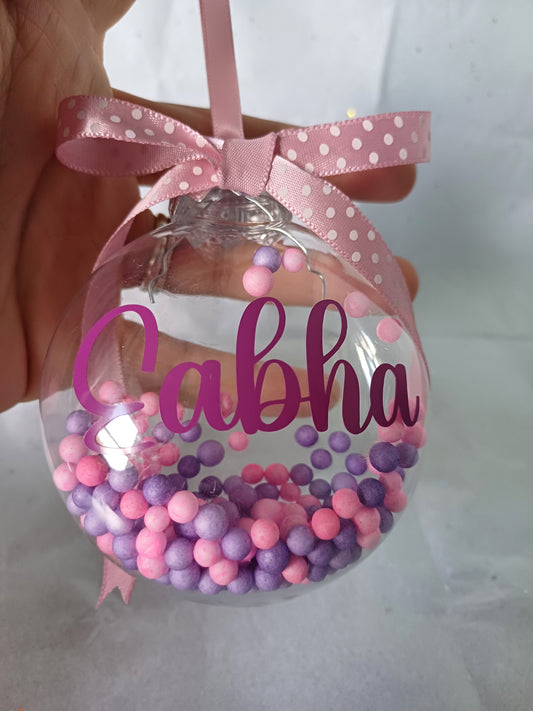 Pink and purple christmas bauble with custom name added